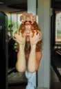 Portrait and hands of scary redhead woman, face reflection in mirror, female duality, mental disorder, subconscious crisis