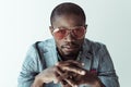 Portrait of handsome african american man in stylish clothes and sunglasses, looking at camera, Royalty Free Stock Photo