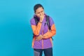 Portrait of handsome Asian man feeling unwell and coughing on blue background Royalty Free Stock Photo