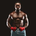 Portrait of handsome athletic boxing fighter with his hands wrapped