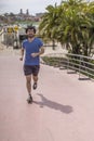 Portrait of handsome attractive mature bearded athletic latin man guy 40s in casual blue t-shirt running Royalty Free Stock Photo