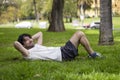 Portrait of handsome attractive mature bearded athletic latin man guy 40s doing sit-ups Royalty Free Stock Photo