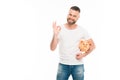 Portrait of handsome bearded man with piggy bank showing ok sign, Royalty Free Stock Photo