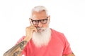Portrait of handsome bearded senior man with white hair and beard looking at the camera, showing mustache Royalty Free Stock Photo