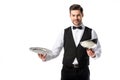 portrait of handsome bearded waiter in suit vest with empty serving tray Royalty Free Stock Photo