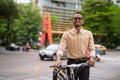 Portrait of handsome black young African businessman outdoors in city Royalty Free Stock Photo