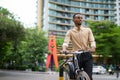 Portrait of handsome black young African businessman outdoors in city Royalty Free Stock Photo