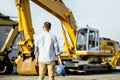 Builder at the shop with heavy machinery Royalty Free Stock Photo