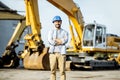 Builder at the shop with heavy machinery Royalty Free Stock Photo