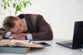 Portrait of a handsome business man sleeping at work in the office Royalty Free Stock Photo