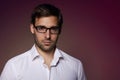 Portrait of handsome businesslike banker in eyeglasses