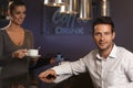 Portrait of handsome businessman in bar