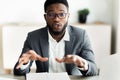 Portrait of handsome businessman looking in camera and talking Royalty Free Stock Photo