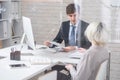 Handsome Man Meeting with Colleague in Office Royalty Free Stock Photo