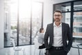 Im ready for success. Portrait of a handsome businessman standing in the boardroom during a meeting. Royalty Free Stock Photo