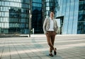 Portrait of an handsome businessman, summer day, outdoors near modern business centre