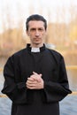 Portrait of handsome catholic priest or pastor with collar Royalty Free Stock Photo