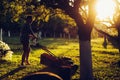 Portrait of caucasian garden worker using a lawnmower Royalty Free Stock Photo