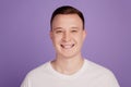 Portrait of handsome cheerful positive guy toothy beaming smile on purple background Royalty Free Stock Photo