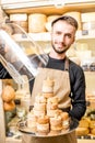 Cheese seller at the shop Royalty Free Stock Photo