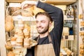 Cheese seller at the shop Royalty Free Stock Photo