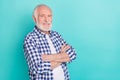 Portrait of handsome clever mature businessman with crossed arms wear fashionable shirt isolated on blue color