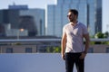 Portrait of handsome confident man in city. Portrait of confident man in modern big american city. Stylish lambersexual Royalty Free Stock Photo