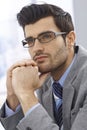 Portrait of handsome daydreaming businessman