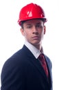 Portrait of handsome engineer with red hardhat on his head