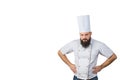 Portrait of handsome evil male chef in uniform hands on waist isolated on white background, copy space on side. Royalty Free Stock Photo