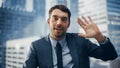 Portrait of Handsome Experienced Businessman Talking with Clients on Video Call in Modern Office Royalty Free Stock Photo