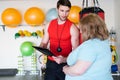Personal Trainer Talking to Client Royalty Free Stock Photo