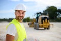 Portrait of handsome foreman construction worker on industrial building industry construction site