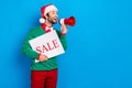 Portrait of handsome funny guy hold paper sale blank loudspeaker talk speak x-mas offer isolated on blue color