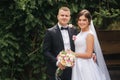 Portrait of handsome groom and charming bride. Romantic atmophere on the wedding Royalty Free Stock Photo