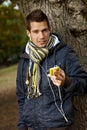 Portrait of handsome guy with mp3 player outdoors Royalty Free Stock Photo