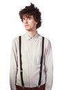 Portrait of a handsome guy in a white shirt with suspenders over Royalty Free Stock Photo