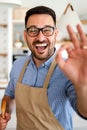 Portrait of handsome happy man cooking at home preparing food in kitchen. Royalty Free Stock Photo