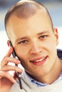 Portrait of handsome, happy man talking on his cell phone outsid Royalty Free Stock Photo