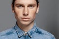 Portrait of a handsome long-haired man with freckles dressed in a denim shirt Royalty Free Stock Photo