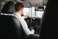 Portrait of a handsome male chauffeur sitting in a car Royalty Free Stock Photo