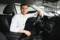 Portrait of a handsome male chauffeur sitting in a car Royalty Free Stock Photo