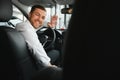 Portrait of a handsome male chauffeur sitting in a car Royalty Free Stock Photo