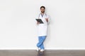 Portrait Of Handsome Male Doctor In Uniform With Clipboard In Hands Royalty Free Stock Photo