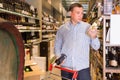 Portrait of handsome man buying wine Royalty Free Stock Photo