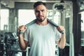 Portrait of Handsome Man is Exercising in Fitness Club.,Portrait of Strong Man Doing Working Out Calories Burning in Gym., Healthy Royalty Free Stock Photo
