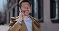 Portrait handsome man in glasses having phone talk on the street. Business man talking on smartphone at street. Outdoor Royalty Free Stock Photo