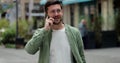 Portrait handsome man in glasses having phone talk on the street. Young business man talking on smartphone at street Royalty Free Stock Photo