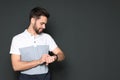 Portrait of handsome man looking at wristwatch Royalty Free Stock Photo