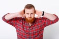 Man with red hair and beard in plaid shirt